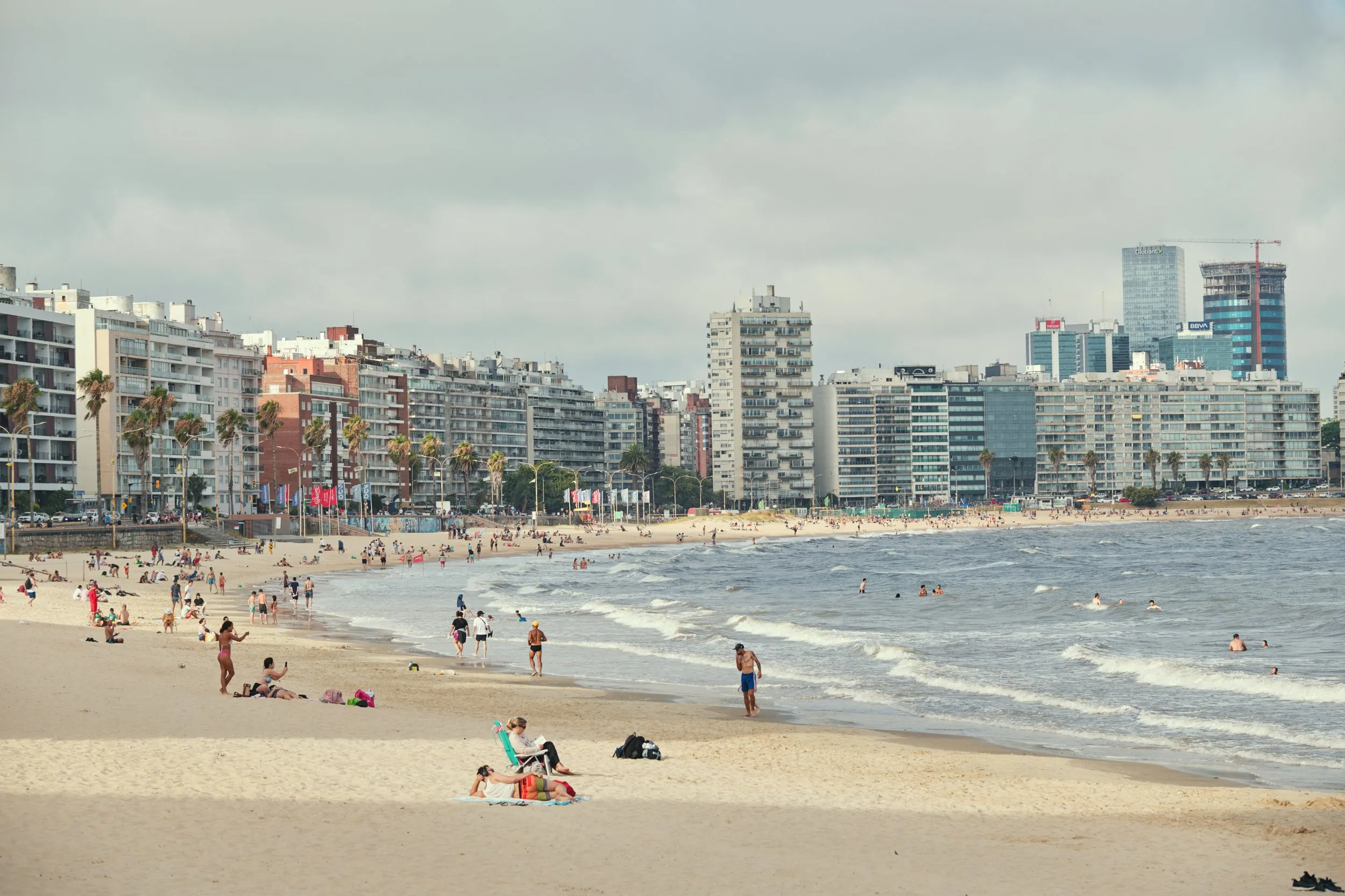 Playa Pocitos and its buildings, seen from the water's edge
