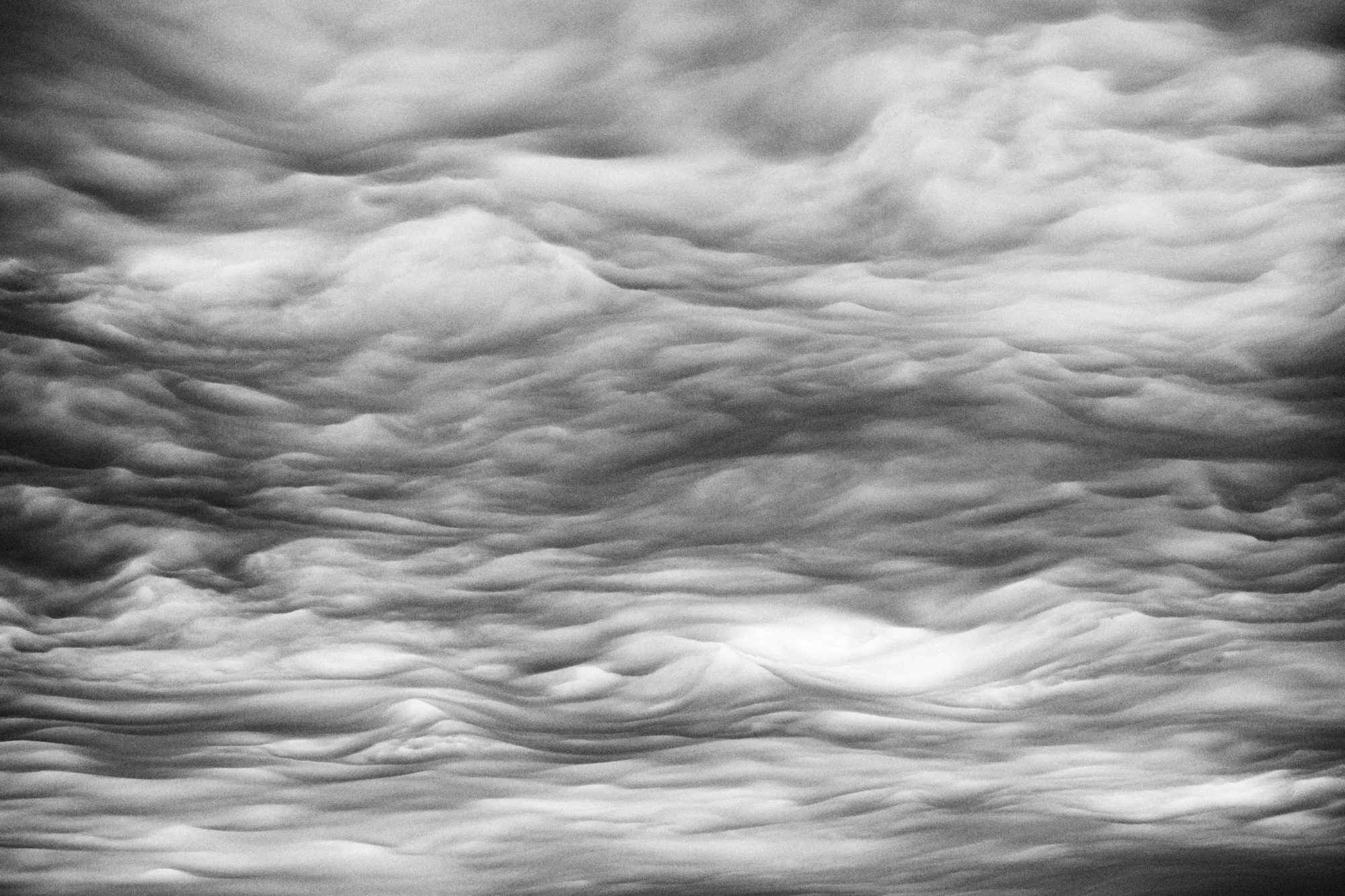 A sky rippled like the surface of water, in black and white