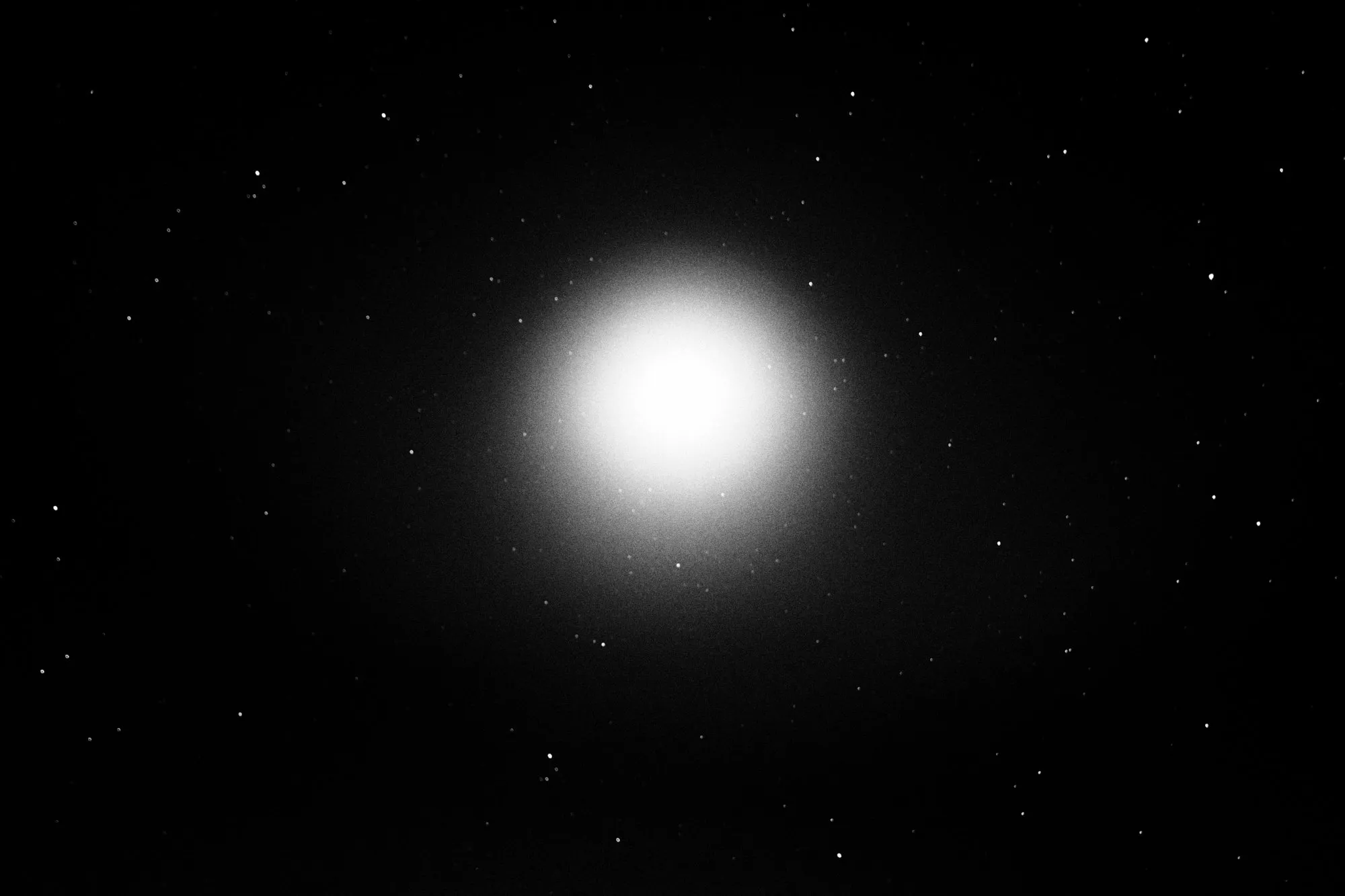A full moon among the stars, in black and white